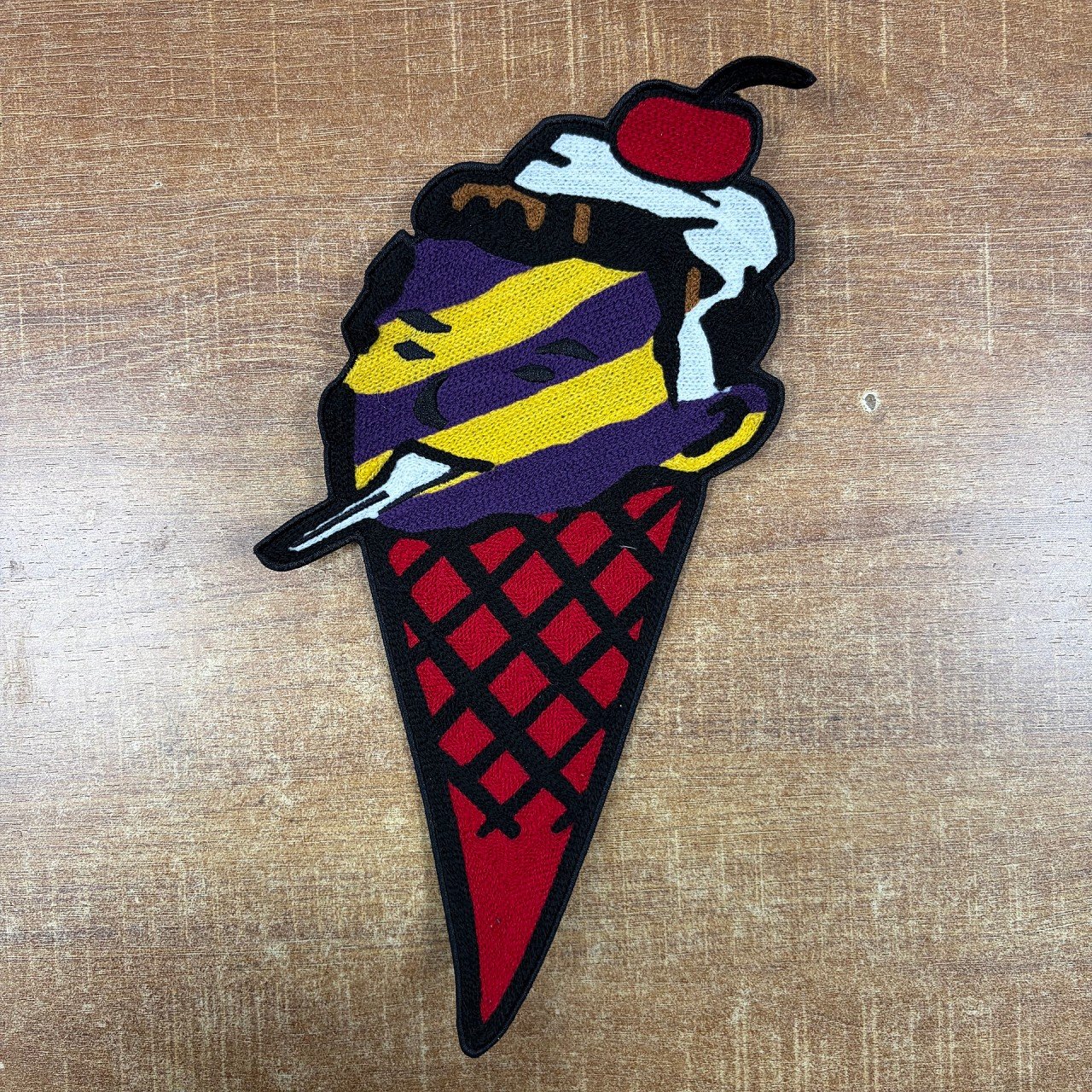 Colorful ice cream cone patch combining chenille areas with flat embroidered details