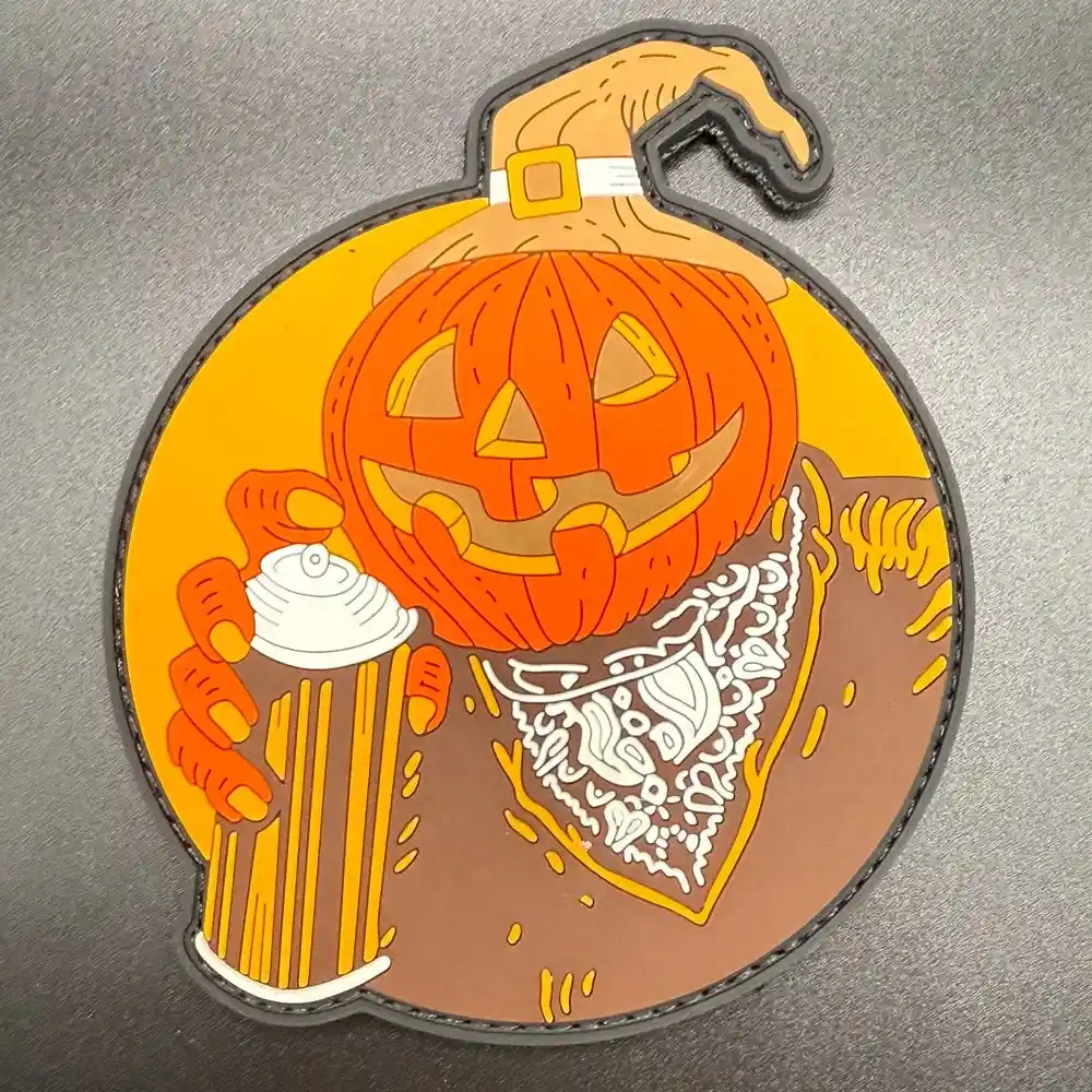 Custom-shaped orange PVC patch with fine molded linework