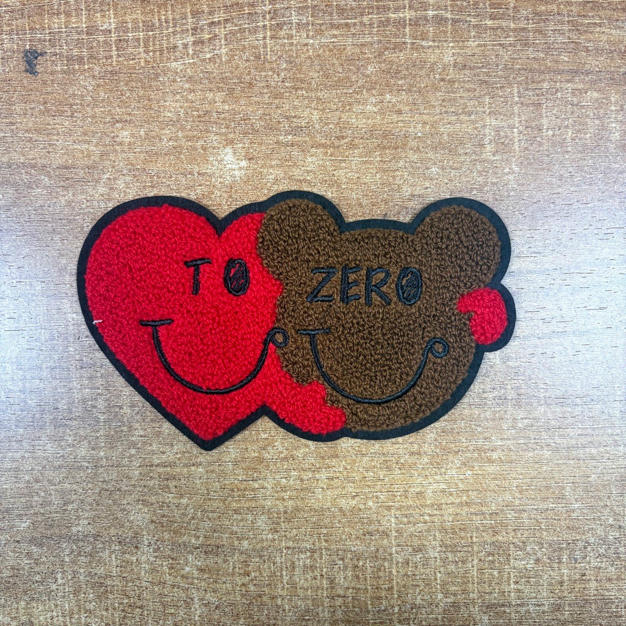 Red heart and brown bear chenille patch with black embroidered faces and wording