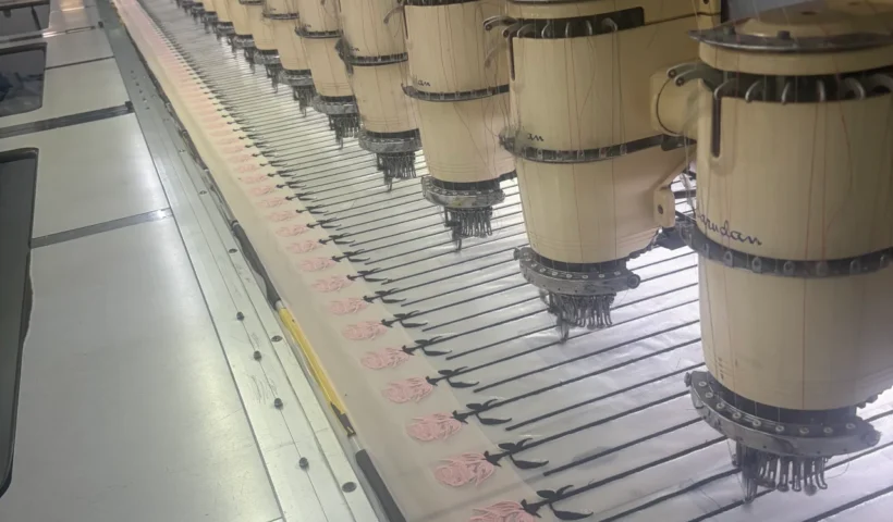 Industrial equipment producing bulk patches at a reliable custom patch manufacturer.