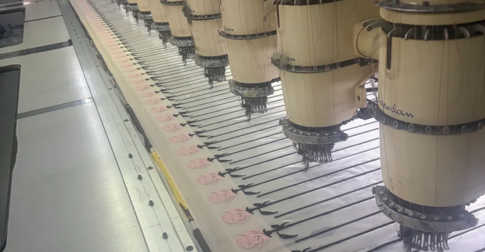 Industrial equipment producing bulk patches at a reliable custom patch manufacturer.