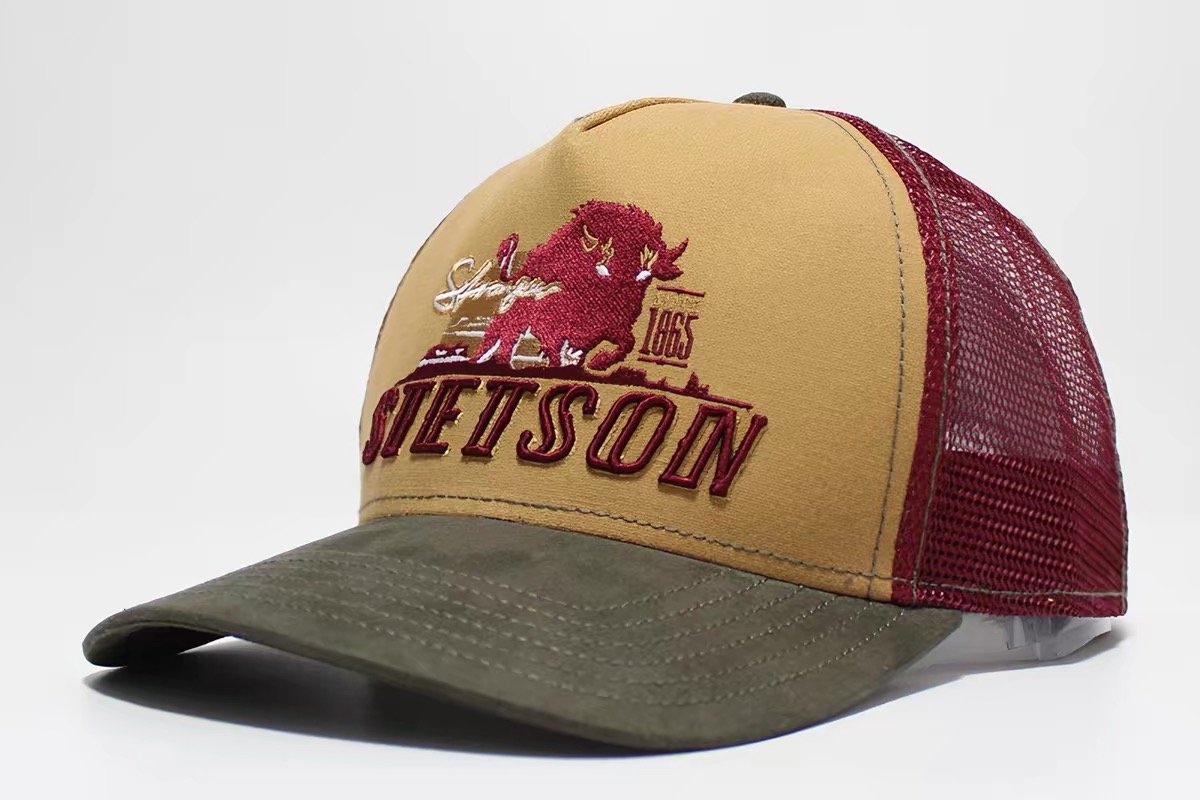 Tan-front trucker hat with burgundy mesh, olive brim and a directly embroidered bison and lettering design