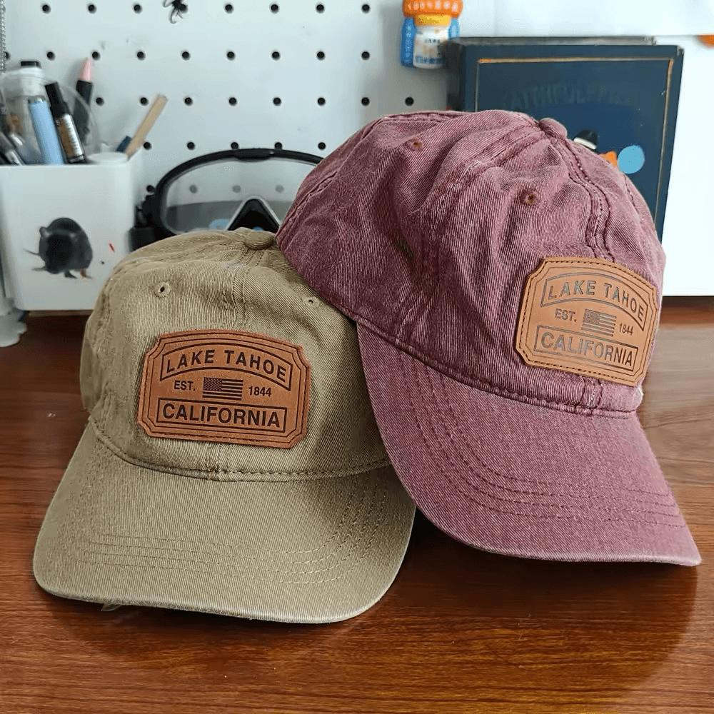 Khaki and burgundy washed caps with matching tan leather patches on the front.